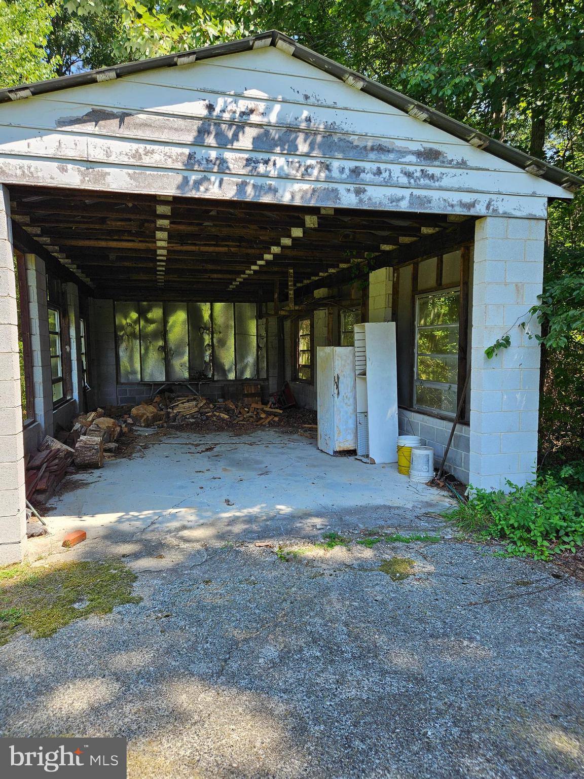 16485 Dawn Boulevard Hanover, VA 23069 - Photo 5 of 29 a view of a patio with table and chairs under an umbrella