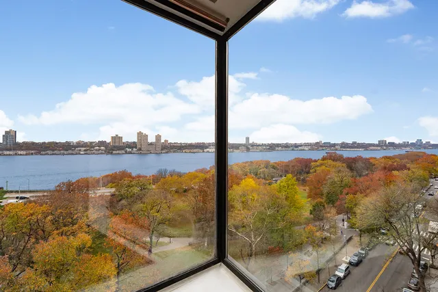 a view of a livingroom with furniture and a window