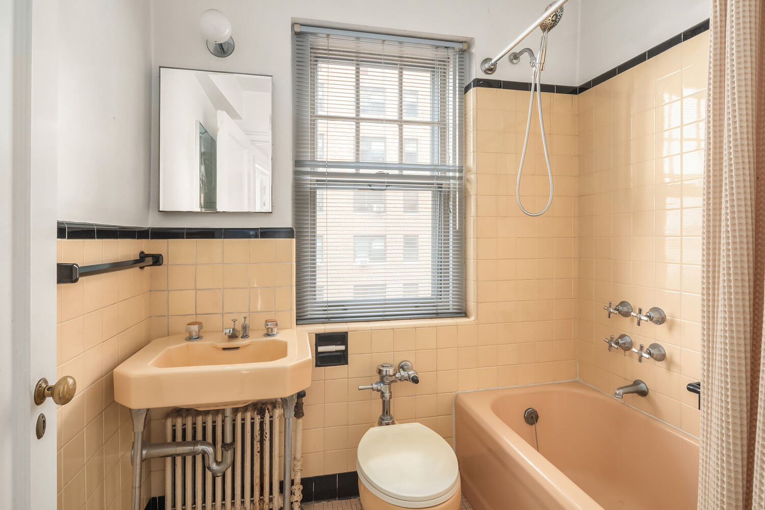 5 Riverside Drive, Unit 11C Manhattan, NY 10023 - Photo 11 of 12 a bathroom with a sink and a bathtub