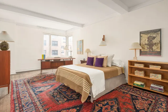 a kitchen with a sink a stove and cabinets