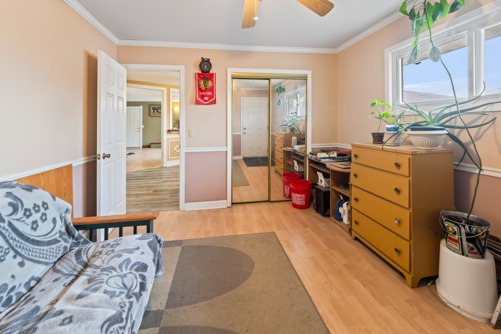 1119 East Algonquin Road, Unit 11 Arlington Heights, IL 60005 - Photo 11 of 15 a bedroom with furniture and a wooden floor