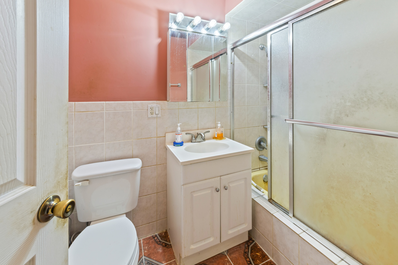 1119 East Algonquin Road, Unit 11 Arlington Heights, IL 60005 - Photo 13 of 15 a bathroom with a sink a toilet and a mirror