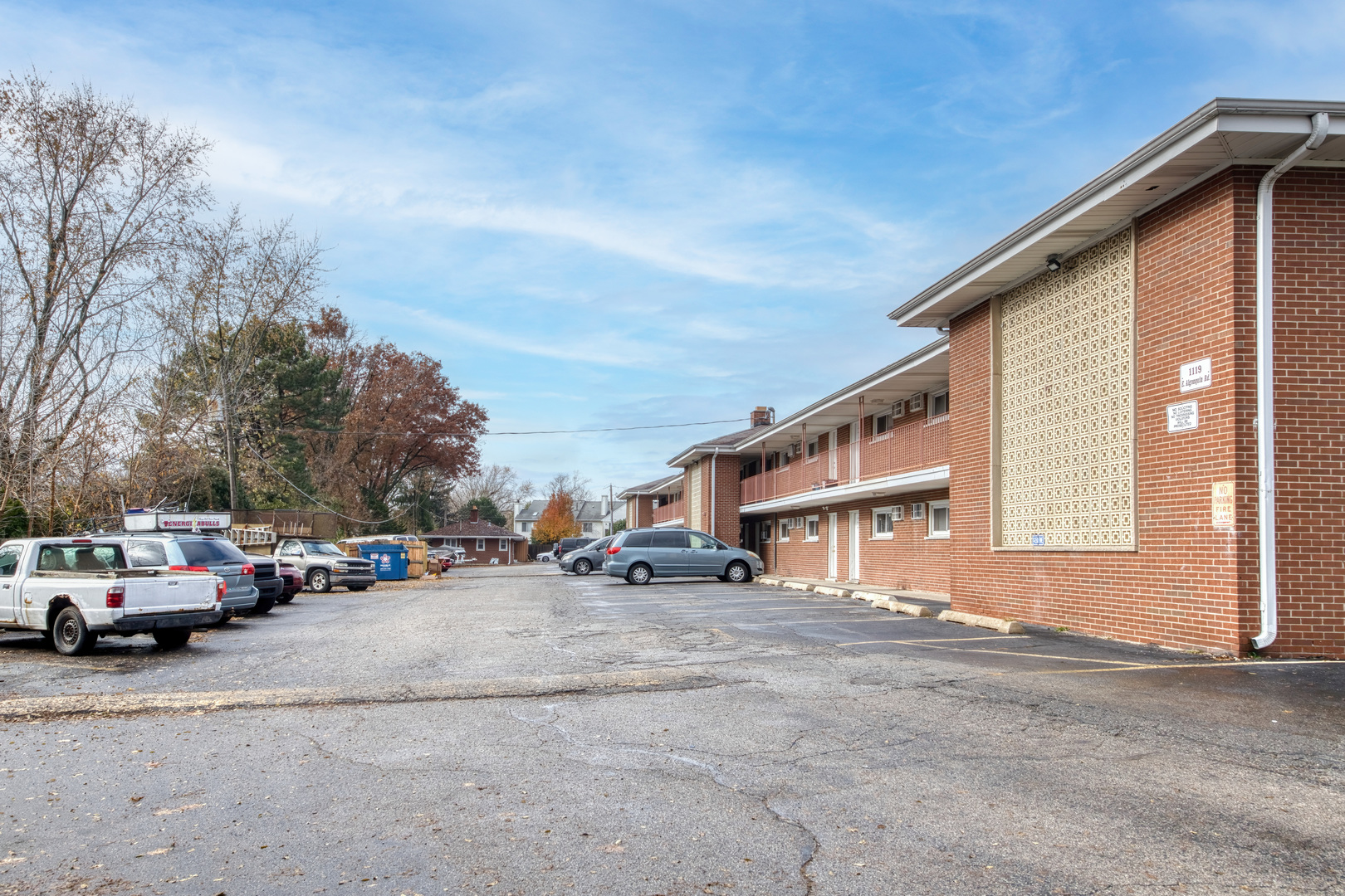 1119 East Algonquin Road, Unit 11 Arlington Heights, IL 60005 - Photo 15 of 15 a view of road with card parked on side and retail shops