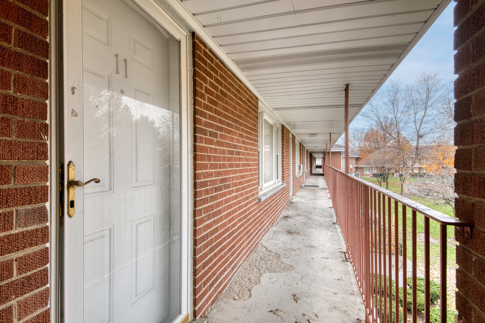 1119 East Algonquin Road, Unit 11 Arlington Heights, IL 60005 - Photo 3 of 15 a view of a pathway of a house