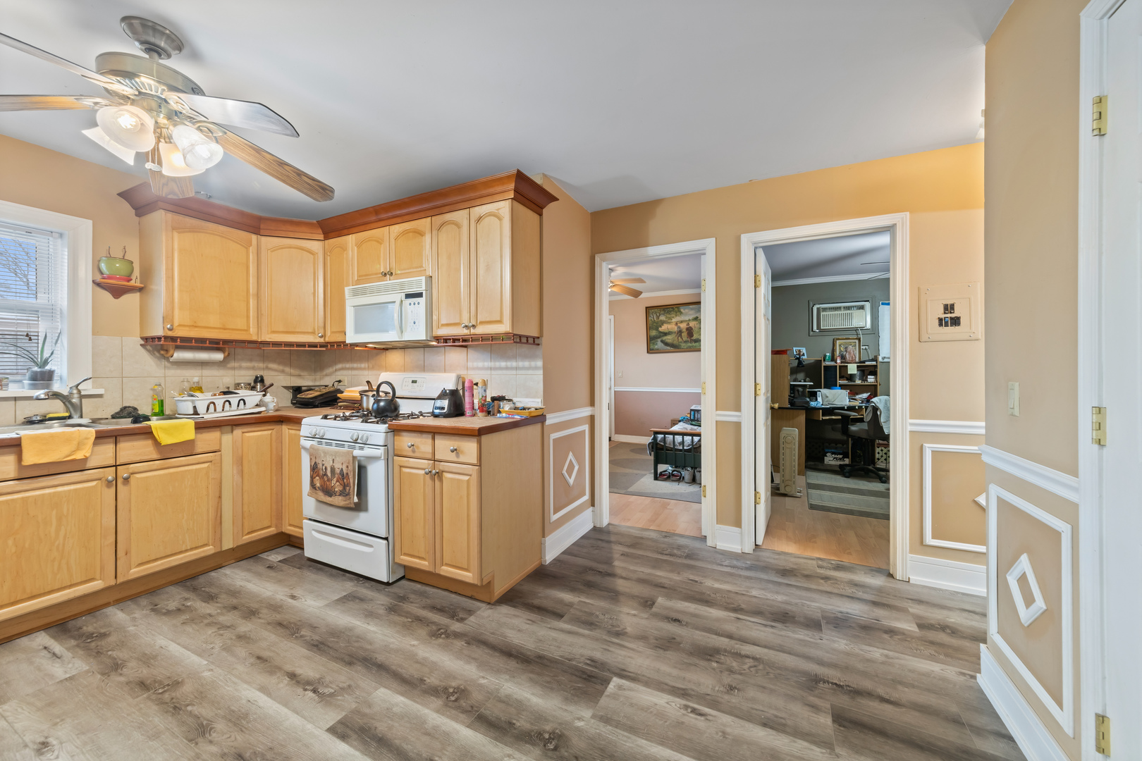 1119 East Algonquin Road, Unit 11 Arlington Heights, IL 60005 - Photo 8 of 15 a kitchen with white cabinets and appliances