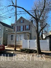 a front view of a house with parking