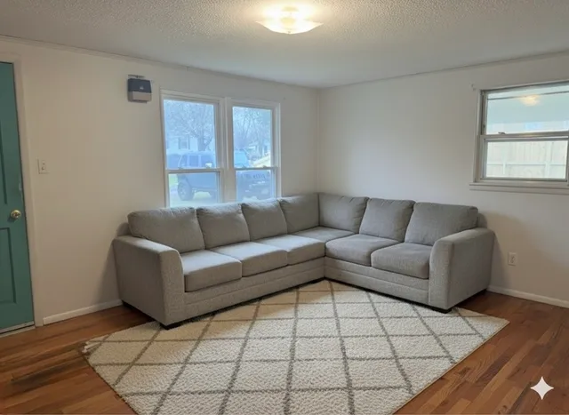 a living room with a couch and a table in it