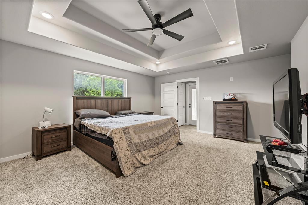 1034 Antelope Trail Temple, TX 76504 - Photo 11 of 24 a bedroom with a bed closet and a flat tv screen