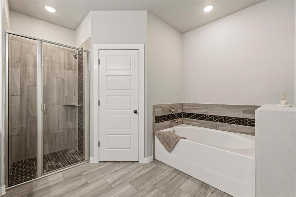 1034 Antelope Trail Temple, TX 76504 - Photo 14 of 24 a bathroom with a tub and shower