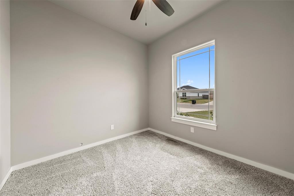 1034 Antelope Trail Temple, TX 76504 - Photo 15 of 24 an empty room with cabinet and windows