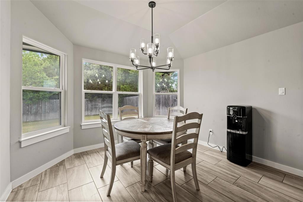 1034 Antelope Trail Temple, TX 76504 - Photo 5 of 24 a view of a dining room with furniture large window and wooden floor