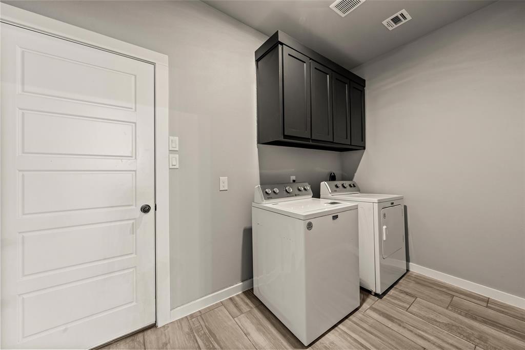 1034 Antelope Trail Temple, TX 76504 - Photo 9 of 24 a utility room with cabinets washer and dryer