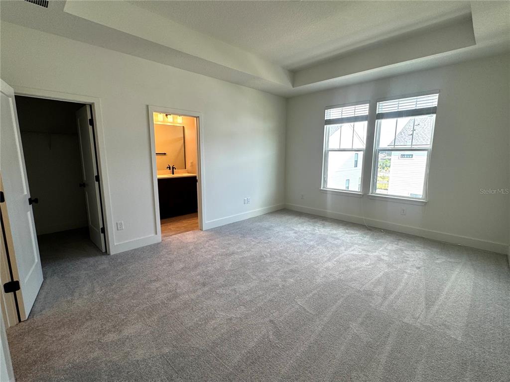 15250 Groveside Road Winter Garden, FL 34787 - Photo 9 of 15 an empty room with windows and closet