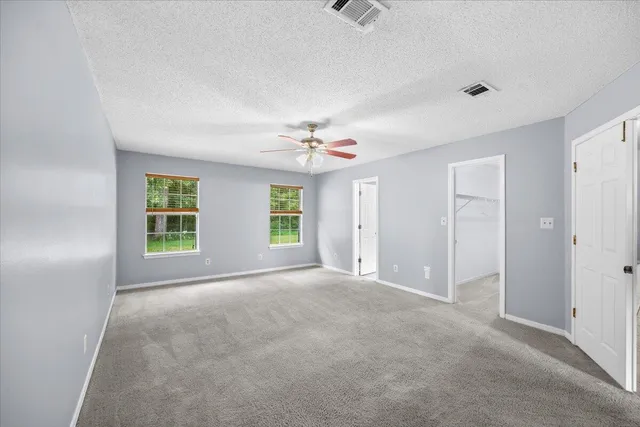 a view of a hallway with washer and dryer