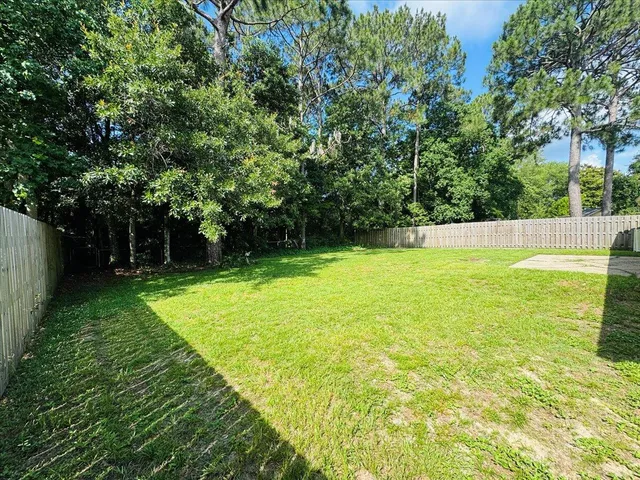 a backyard of a house with lots of green space