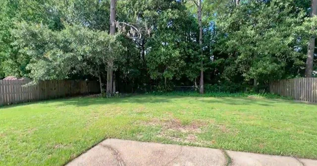a view of yard and outdoor seating
