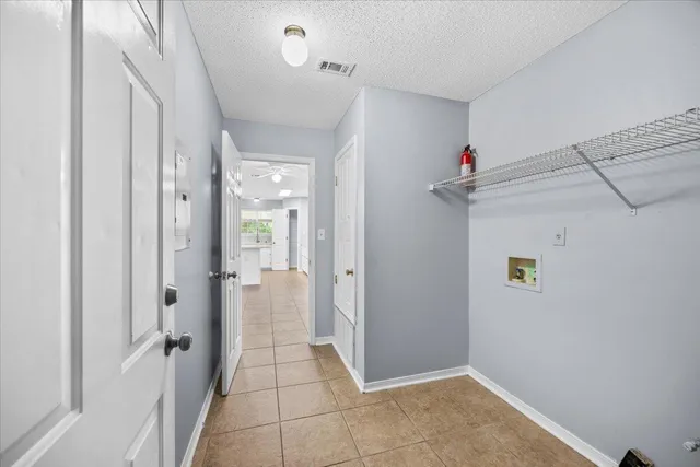 a view of a bathroom with a sink mirror and shower