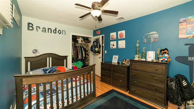 a bedroom with furniture and a dresser