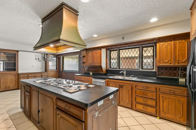 a view of a hallway with wooden floor and a living room