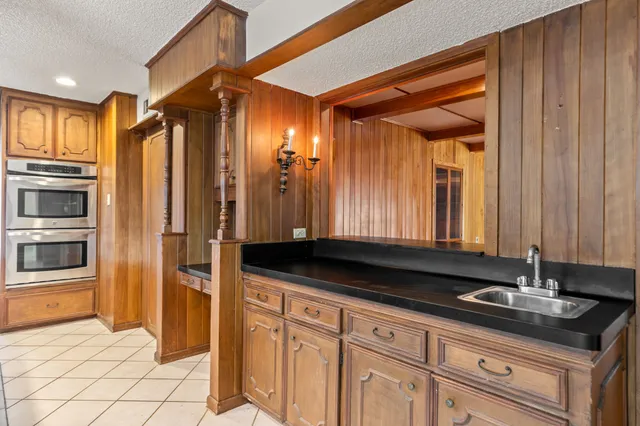 a view of an empty room with a window and balcony