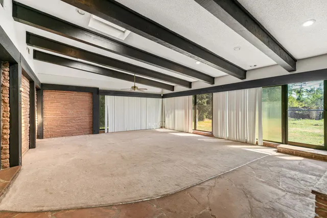 a bathroom with a bathtub and shower
