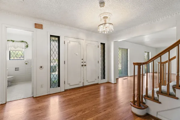 a view of entryway with wooden floor