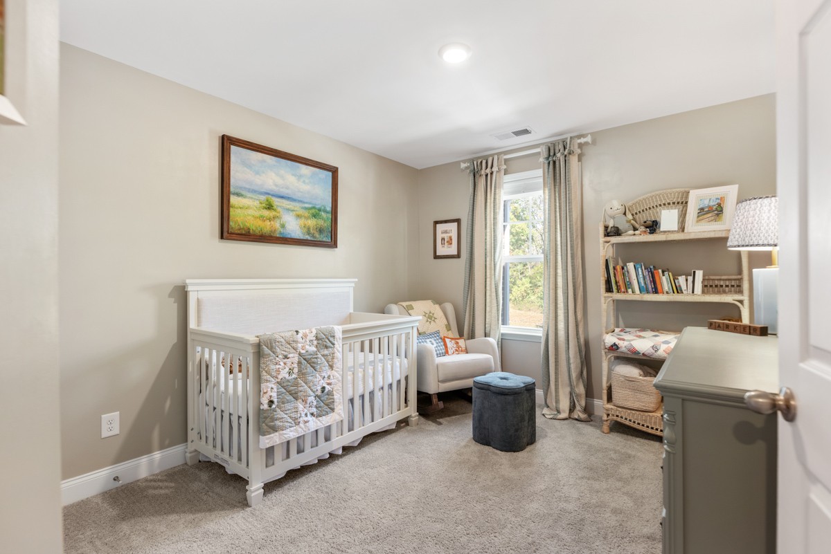 235 Grandstand Boulevard Gallatin, TN 37066 - Photo 20 of 26 a bedroom with a bed and a window