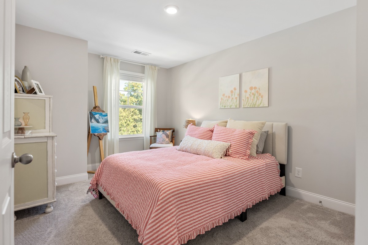 235 Grandstand Boulevard Gallatin, TN 37066 - Photo 22 of 26 a bedroom with a bed and a window