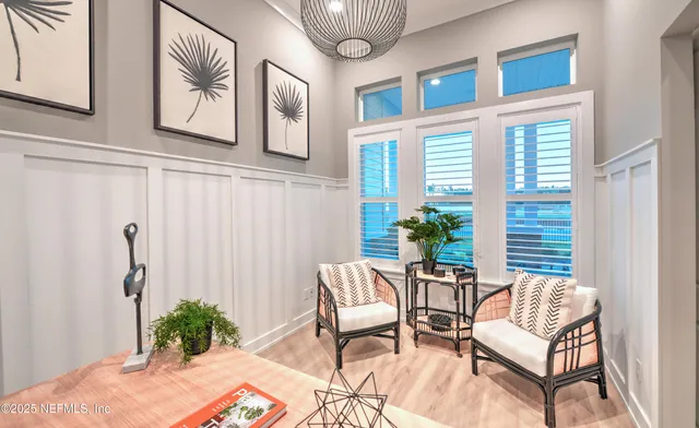 a dining room with furniture and wooden floor