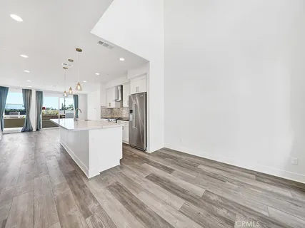 a view of kitchen with wooden floor
