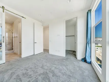 a view of an empty room with a fireplace