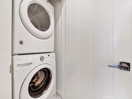 a close view of a utility room with dryer and washer
