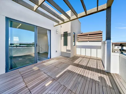 a view of outdoor space with wooden floor and seating space