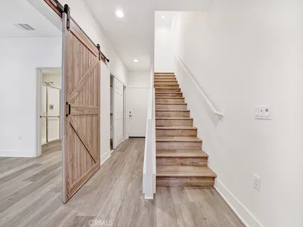 a view of entryway with wooden floor