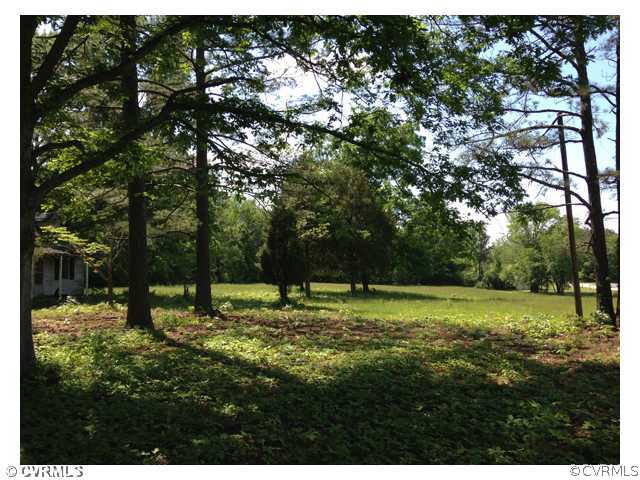 15001 Beach Road Chesterfield, VA 23838 - Photo 3 of 3 a backyard of a house with a yard and outdoor seating
