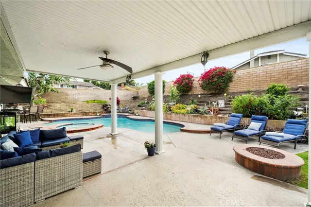 a outdoor space with patio couch and a potted plant