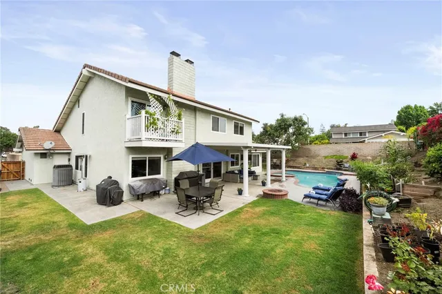 a house view with a sitting space garden view with a outdoor space