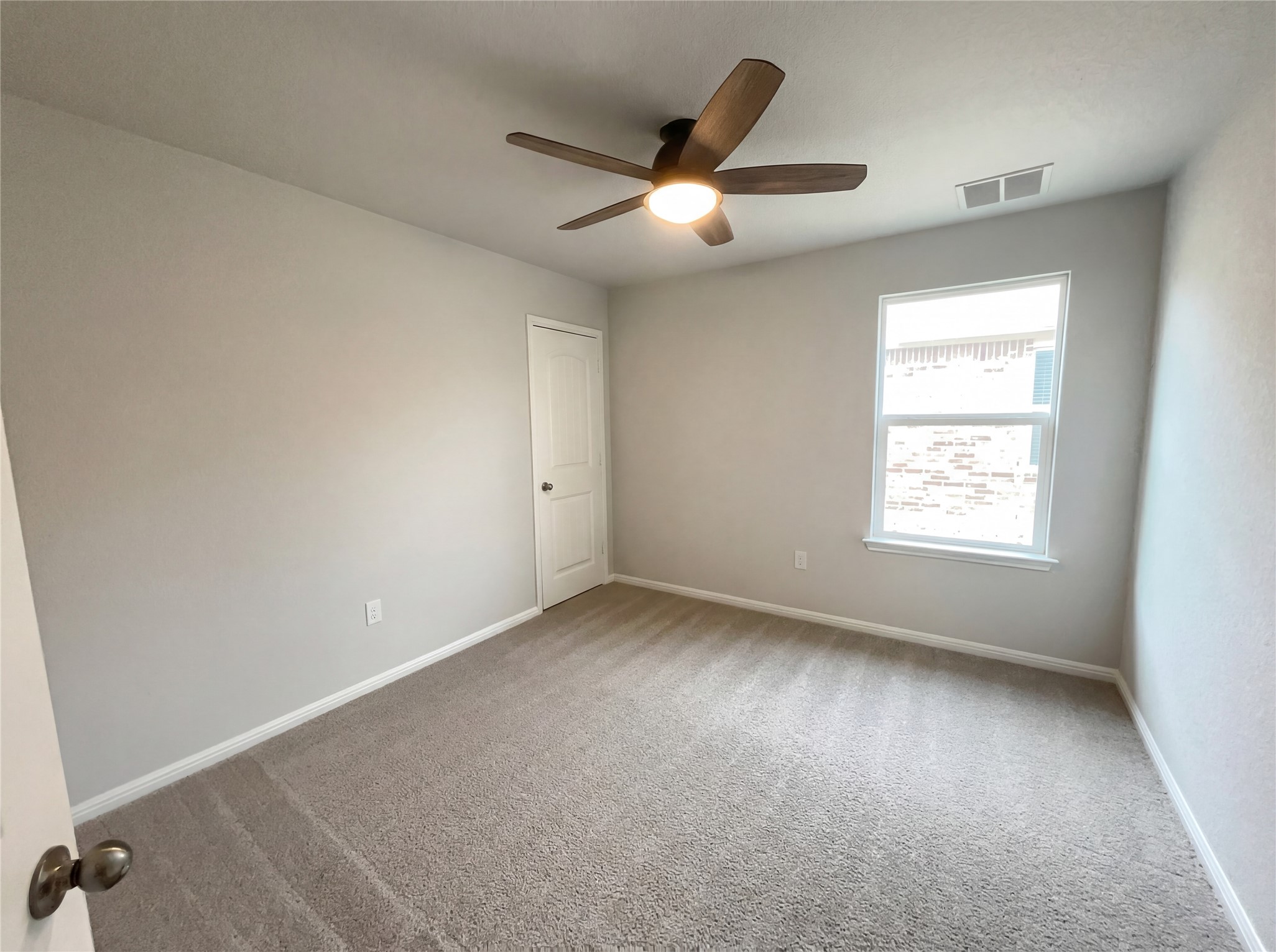 413 Dubina Avenue Georgetown, TX 78626 - Photo 12 of 22 Spare room featuring carpet and ceiling fan