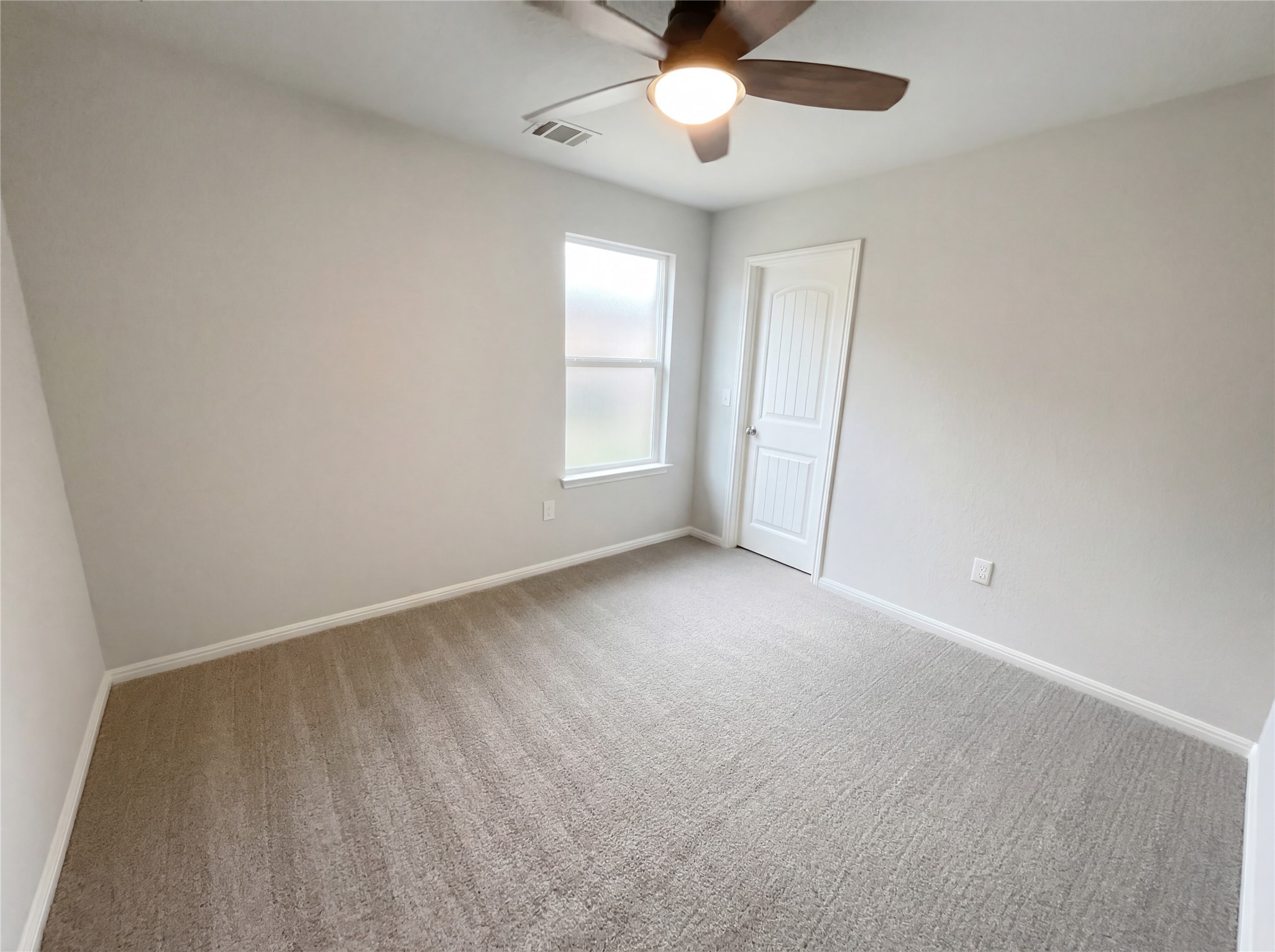 413 Dubina Avenue Georgetown, TX 78626 - Photo 14 of 22 Carpeted empty room featuring a ceiling fan and baseboards