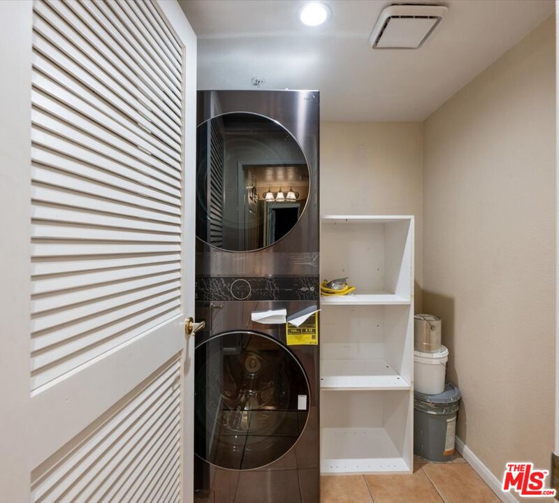 15114 Sherman Way, Unit 104 Van Nuys, CA 91405 - Photo 10 of 19 a utility room with dryer and washer
