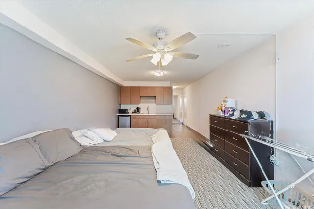 a en suite bathroom with a sink mirror and shower