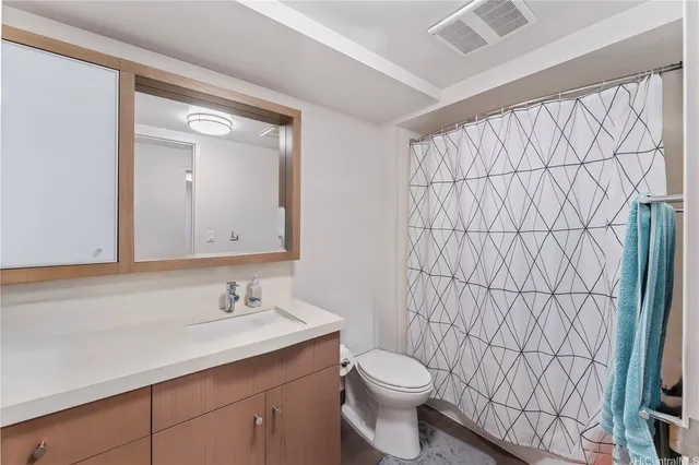 a patio with yard glass top table and chairs