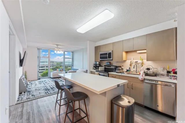 a kitchen with a table chairs stove and cabinets