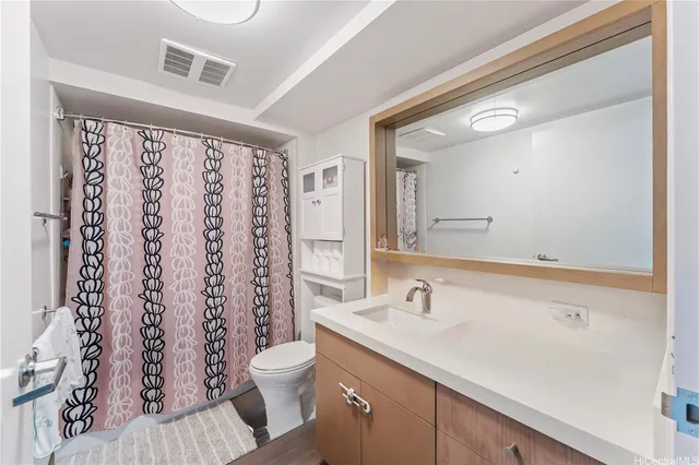 a bathroom with a sink a mirror and a shower