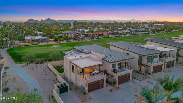an aerial view of a house with a big yard