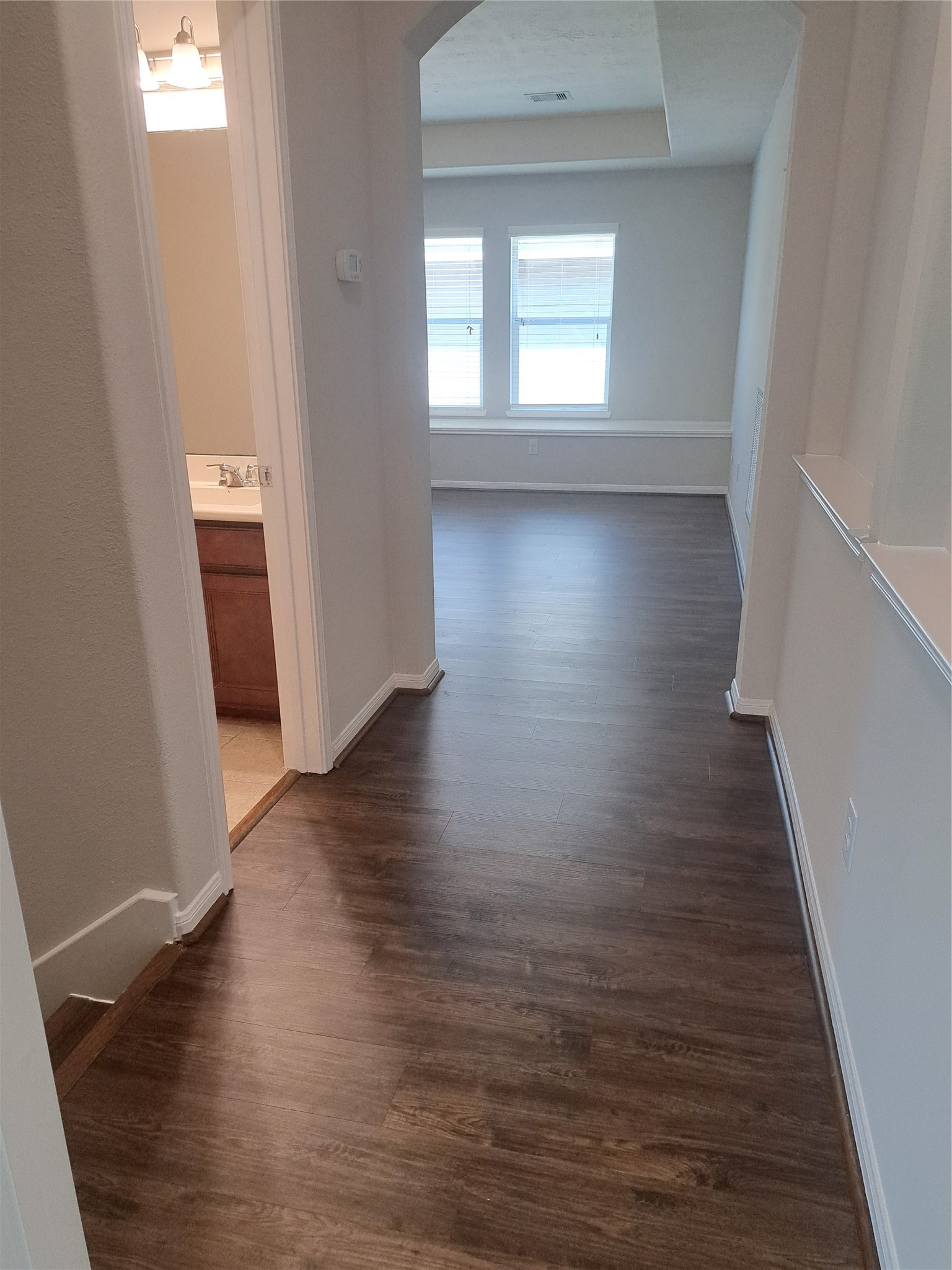 26315 Fox Ridge Lane Katy, TX 77494 - Photo 27 of 39 a view of a hallway with wooden floor