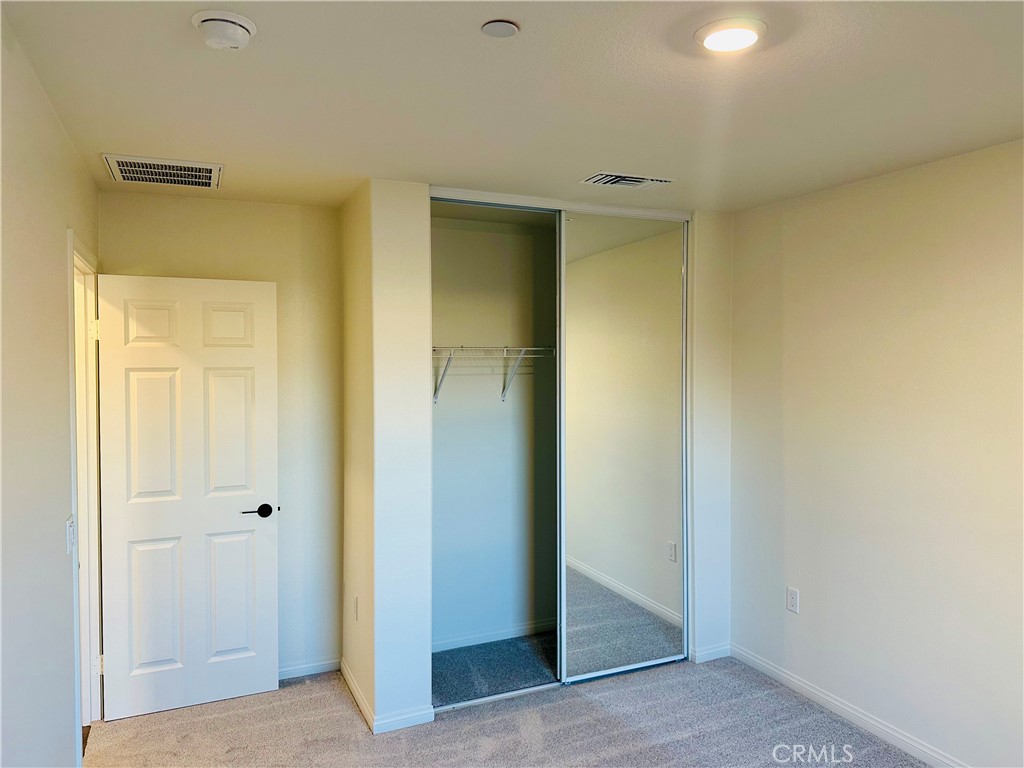 916 Runaway Trail San Jacinto, CA 92582 - Photo 17 of 23 a view of an empty room