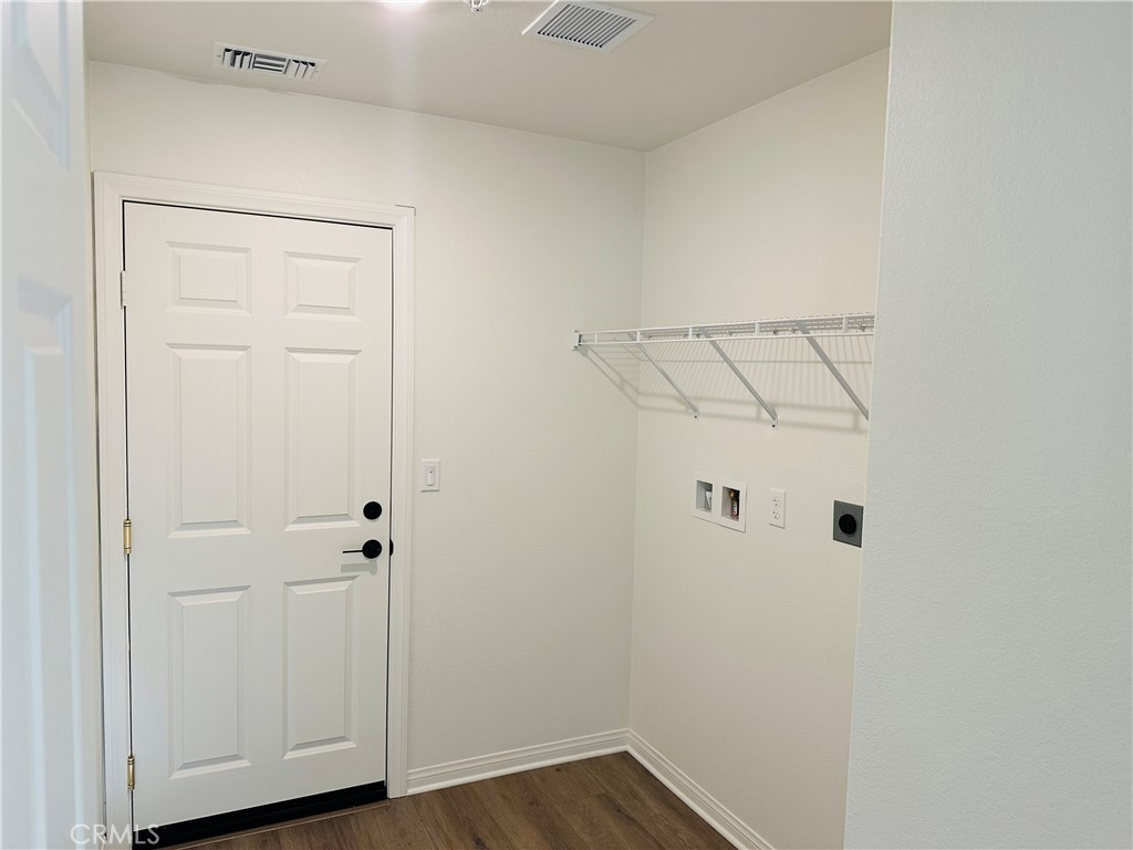 916 Runaway Trail San Jacinto, CA 92582 - Photo 21 of 23 a view of a room with wooden floor