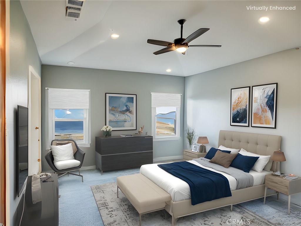 916 Runaway Trail San Jacinto, CA 92582 - Photo 5 of 23 a bedroom with a bed and a chandelier