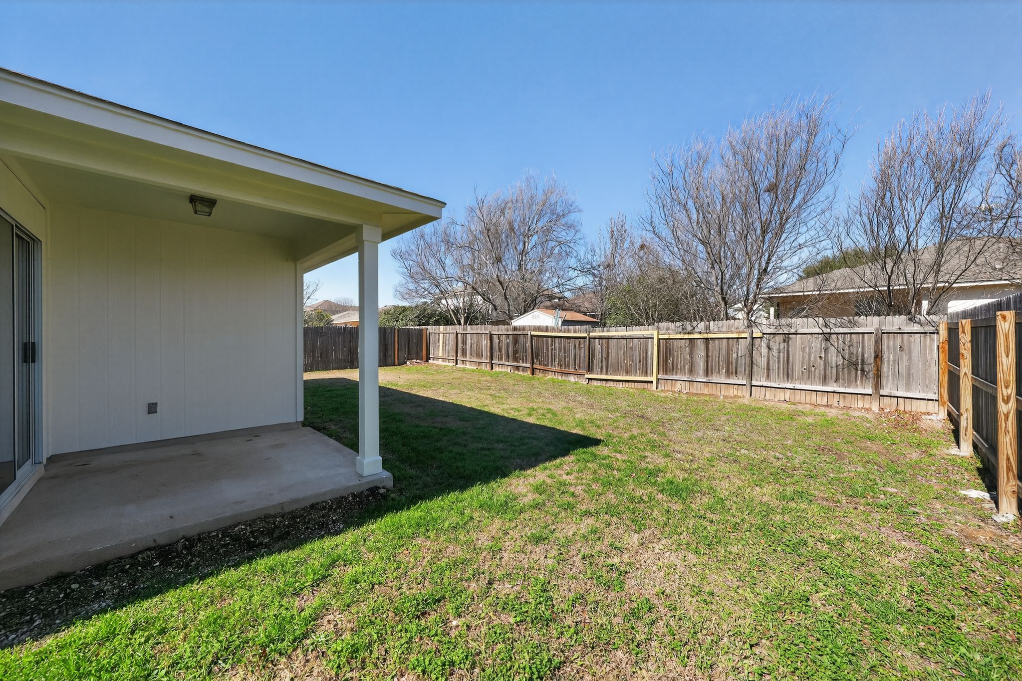 1007 Gentry Drive Leander, TX 78641 - Photo 32 of 35 a view of a backyard with large trees